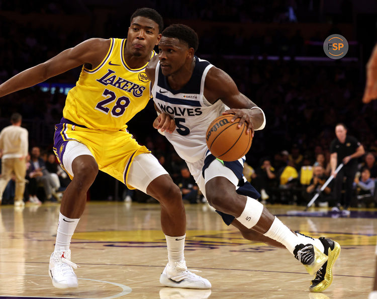 Oct 22, 2024; Los Angeles, California, USA; Minnesota Timberwolves guard Anthony Edwards (5) drives against Los Angeles Lakers forward Rui Hachimura (28) during the fourth quarter at Crypto.com Arena. Credit: Jason Parkhurst-Imagn Images