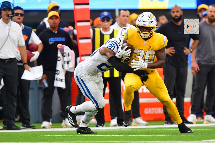Oct 19, 2025; Inglewood, California, USA; Los Angeles Chargers running back Kimani Vidal (30) runs the ball in the second half against the Indianapolis Colts at SoFi Stadium. Credit: Gary A. Vasquez-Imagn Images