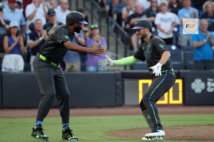 May 23, 2025; St. Petersburg, Florida, USA;  Tampa Bay Rays second base Brandon Lowe (8) is congratulated by third base Junior Caminero (13) after a two-run home run during the third inning against the Toronto Blue Jays at George M. Steinbrenner Field. Credit: Kim Klement Neitzel-Imagn Images