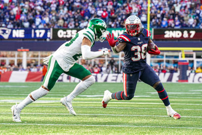 Oct 27, 2024; Foxborough, Massachusetts, USA; New England Patriots running back Rhamondre Stevenson (38) runs the ball against New York Jets cornerback Isaiah Oliver (23) in the second half at Gillette Stadium. Mandatory Credit: David Butler II-Imagn Images