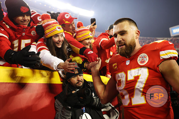KANSAS CITY, MISSOURI - JANUARY 23: Travis Kelce #87 of the Kansas City Chiefs celebrates with fans after defeating the Buffalo Bills in the AFC Divisional Playoff game at Arrowhead Stadium on January 23, 2022 in Kansas City, Missouri. The Kansas City Chiefs defeated the Buffalo Bills with a score of 42 to 36. (Photo by Jamie Squire/Getty Images)