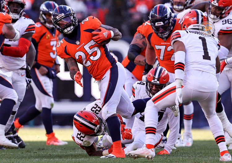 DENVER, CO - NOVEMBER 26: Denver Broncos running back Samaje Perine (25) fights for yardage during an NFL game between the Cleveland Browns and the Denver Broncos on November 26, 2023 at Empower Field at Mile High in Denver, CO. (Photo by Steve Nurenberg/Icon Sportswire)