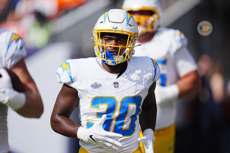 Oct 13, 2024; Denver, Colorado, USA; Los Angeles Chargers running back Kimani Vidal (30) following a touchdown in the first quarter against the Denver Broncos at Empower Field at Mile High. Credit: Ron Chenoy-Imagn Images