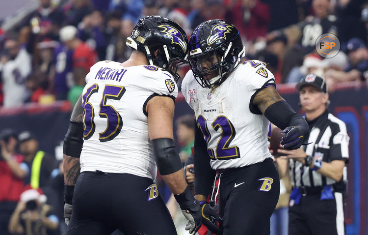 Dec 25, 2024; Houston, Texas, USA; Baltimore Ravens guard Patrick Mekari (65) celebrates  running back Derrick Henry (22) rushing touchdown against the Houston Texans  in the first quarter at NRG Stadium. Credit: Thomas Shea-Imagn Images