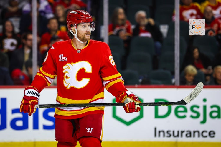 Dec 31, 2025; Calgary, Alberta, CAN; Calgary Flames left wing Blake Coleman (20) against the Philadelphia Flyers during the third period at Scotiabank Saddledome. Credit: Sergei Belski-Imagn Images