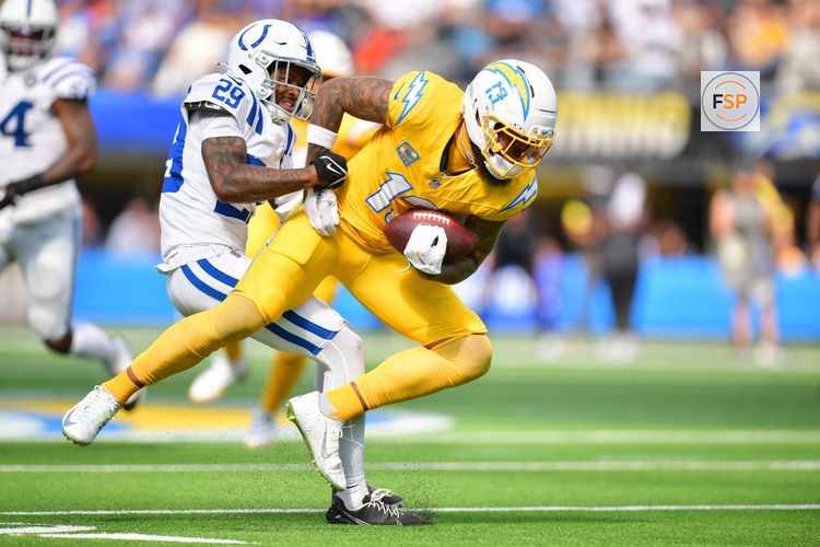 Oct 19, 2025; Inglewood, California, USA; Los Angeles Chargers wide receiver Keenan Allen (13) is brought down by Indianapolis Colts cornerback Mekhi Blackmon (29) in the first half at SoFi Stadium. Credit: Gary A. Vasquez-Imagn Images