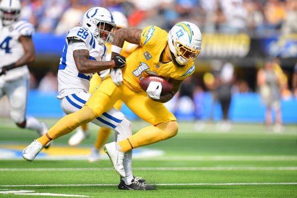 Oct 19, 2025; Inglewood, California, USA; Los Angeles Chargers wide receiver Keenan Allen (13) is brought down by Indianapolis Colts cornerback Mekhi Blackmon (29) in the first half at SoFi Stadium. Mandatory Credit: Gary A. Vasquez-Imagn Images