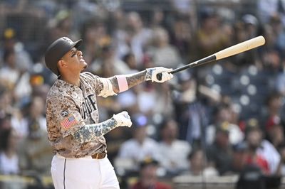 May 10, 2026; San Diego, California, USA; San Diego Padres third baseman Manny Machado (13) hits a walk-off sacrifice fly during the tenth inning against the St. Louis Cardinals at Petco Park. Mandatory Credit: Denis Poroy-Imagn Images