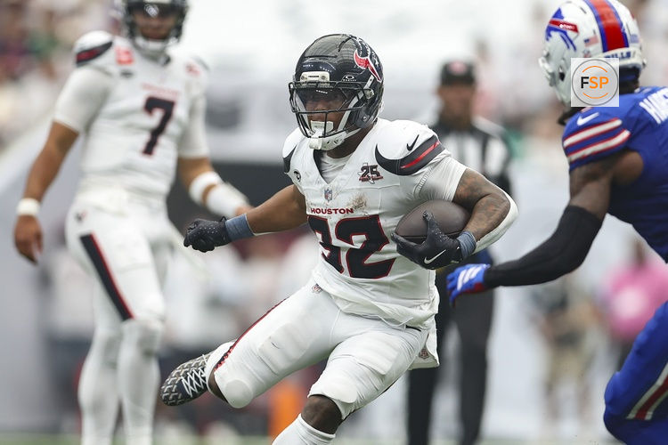 Sep 13, 2026; Houston, Texas, USA; Houston Texans running back David Montgomery (32) runs with the ball during the game against the Buffalo Bills at Reliant Stadium. Credit: Troy Taormina-Imagn Images