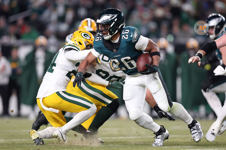 Jan 12, 2025; Philadelphia, Pennsylvania, USA; Philadelphia Eagles running back Saquon Barkley (26) rushes the ball against the Green Bay Packers during the third quarter in an NFC wild card game at Lincoln Financial Field. Credit: Bill Streicher-Imagn Images