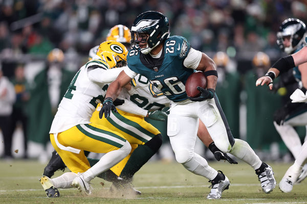 Jan 12, 2025; Philadelphia, Pennsylvania, USA; Philadelphia Eagles running back Saquon Barkley (26) rushes the ball against the Green Bay Packers during the third quarter in an NFC wild card game at Lincoln Financial Field. Mandatory Credit: Bill Streicher-Imagn Images