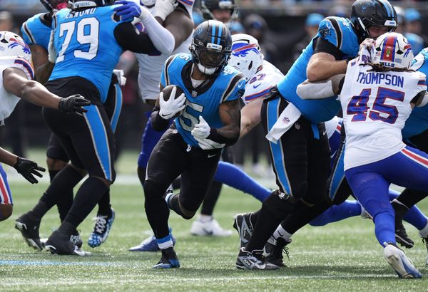 Oct 26, 2025; Charlotte, North Carolina, USA; Carolina Panthers running back Rico Dowdle (5) runs during the first half against the Buffalo Bills at Bank of America Stadium. Mandatory Credit: Jim Dedmon-Imagn Images