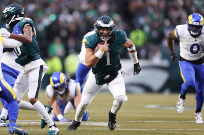 Jan 19, 2025; Philadelphia, Pennsylvania, USA; Philadelphia Eagles quarterback Jalen Hurts (1) runs for a touchdown against the Los Angeles Rams during the first quarter in a 2025 NFC divisional round game at Lincoln Financial Field. Mandatory Credit: Bill Streicher-Imagn Images