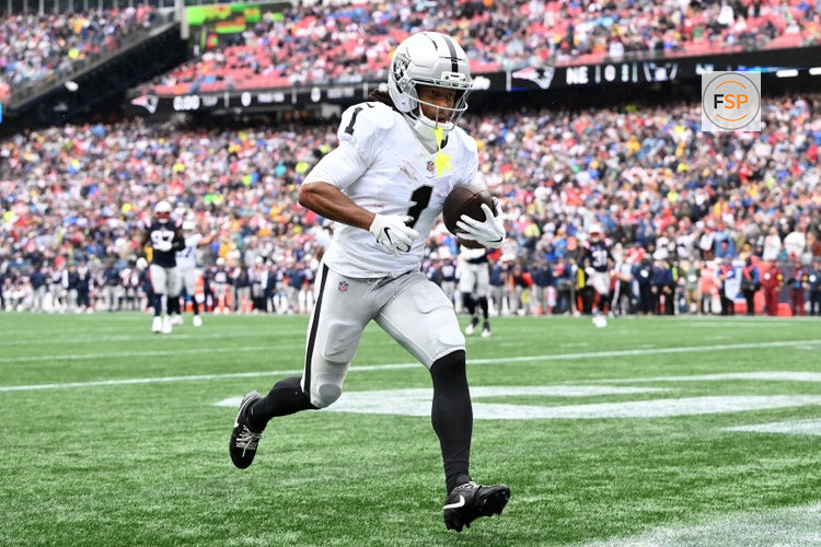 Sep 7, 2025; Foxborough, Massachusetts, USA; Las Vegas Raiders wide receiver Tre Tucker (1) makes a touchdown catch against the New England Patriots during the first half at Gillette Stadium. Credit: Brian Fluharty-Imagn Images