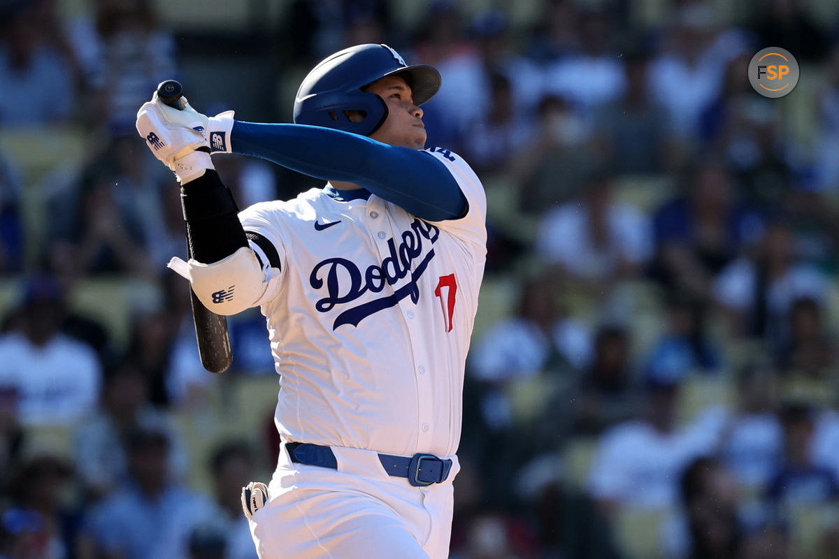 Sep 22, 2024; Los Angeles, California, USA;  Los Angeles Dodgers designated hitter Shohei Ohtani (17) hits a home run during the ninth inning against the Colorado Rockies at Dodger Stadium. Credit: Kiyoshi Mio-Imagn Images