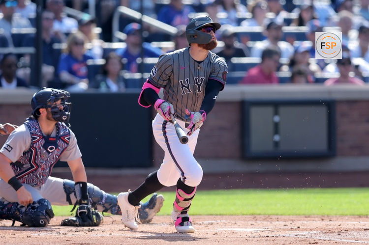 Jul 5, 2025; New York City, New York, USA; New York Mets left fielder Brandon Nimmo (9) follows through on a grand slam against the New York Yankees during the first inning at Citi Field. Credit: Brad Penner-Imagn Images