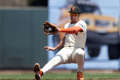 Jun 22, 2025; San Francisco, California, USA; San Francisco Giants third baseman Casey Schmitt (10) falls backward fielding a sharp infield hit by Boston Red Sox third baseman Nate Eaton during the second inning at Oracle Park. Mandatory Credit: D. Ross Cameron-Imagn Images