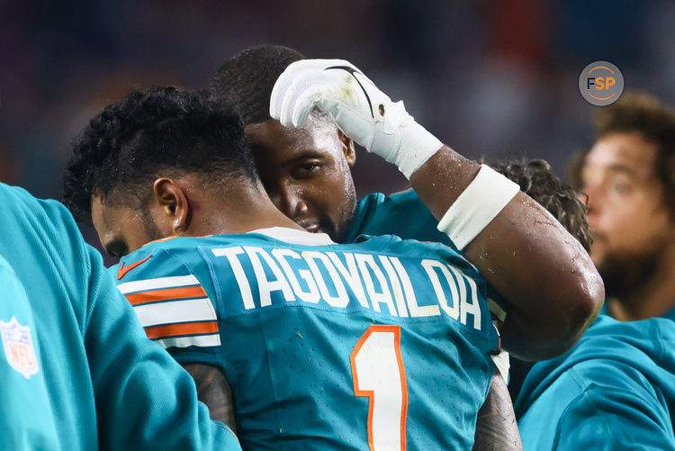 Sep 12, 2024; Miami Gardens, Florida, USA; Miami Dolphins quarterback Tua Tagovailoa (1) walks off the field after an apparent injury against the Buffalo Bills during the third quarter at Hard Rock Stadium. Credit: Sam Navarro-Imagn Images