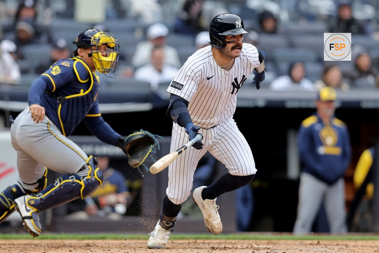Mar 30, 2025; Bronx, New York, USA; New York Yankees catcher Austin Wells (28) follows through on an RBI groundout against the Milwaukee Brewers during the sixth inning at Yankee Stadium. Credit: Brad Penner-Imagn Images