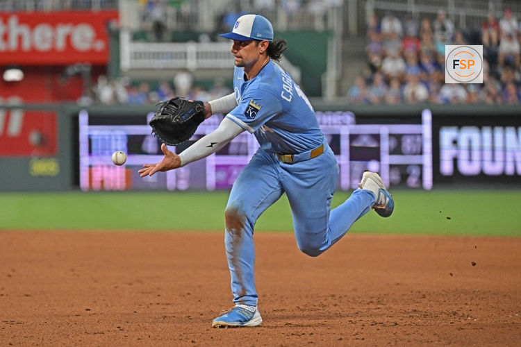 Aug 8, 2026; Kansas City, Missouri, USA;  Kansas City Royals first baseman Jac Caglianone (14) tosses the ball to first base for an out in the eighth inning against the Chicago Cubs at Kauffman Stadium. Credit: Peter Aiken-Imagn Images
