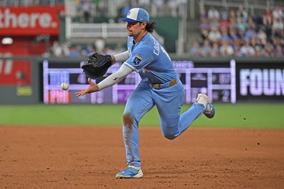 Aug 8, 2026; Kansas City, Missouri, USA;  Kansas City Royals first baseman Jac Caglianone (14) tosses the ball to first base for an out in the eighth inning against the Chicago Cubs at Kauffman Stadium. Mandatory Credit: Peter Aiken-Imagn Images