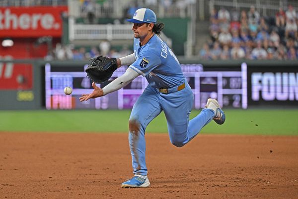 Aug 8, 2026; Kansas City, Missouri, USA;  Kansas City Royals first baseman Jac Caglianone (14) tosses the ball to first base for an out in the eighth inning against the Chicago Cubs at Kauffman Stadium. Mandatory Credit: Peter Aiken-Imagn Images