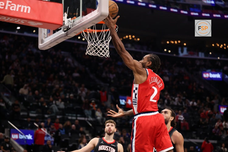 Dec 23, 2025; Inglewood, California, USA;  Los Angeles Clippers forward Kawhi Leonard (2) goes to the basket during the first half against the Houston Rockets at Intuit Dome. Credit: Kiyoshi Mio-Imagn Images