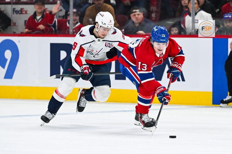 Apr 27, 2025; Montreal, Quebec, CAN; Montreal Canadiens right wing Cole Caufield (13) plays the puck against Washington Capitals right wing Ryan Leonard (9) during the first period in game four of the first round of the 2025 Stanley Cup Playoffs at Bell Centre. Credit: David Kirouac-Imagn Images