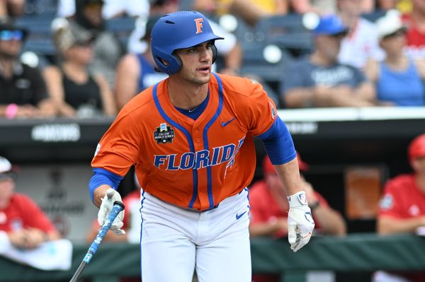 Jun 17, 2024; Omaha, NE, USA;  Florida Gators starting pitcher\designated hitter Jac Caglianone (14) hits a three run home run against the NC State Wolfpack during the second inning at Charles Schwab Field Omaha. Mandatory Credit: Steven Branscombe-USA TODAY Sports