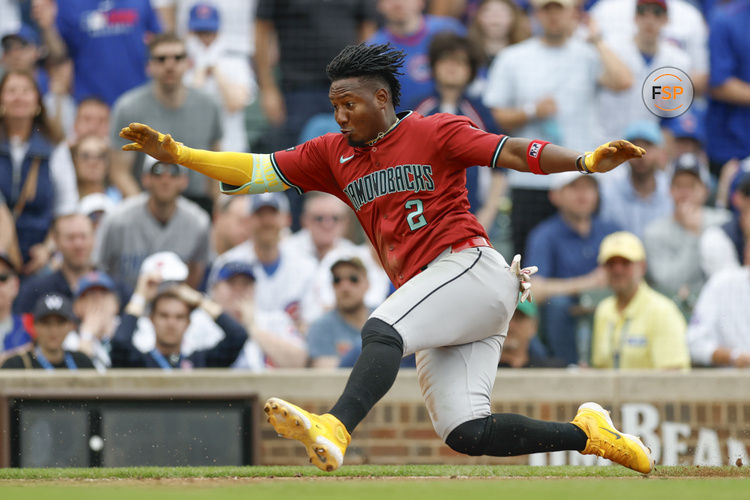Apr 18, 2025; Chicago, Illinois, USA; Arizona Diamondbacks shortstop Geraldo Perdomo (2) runs to score against the Chicago Cubs during the eight inning at Wrigley Field. Credit: Kamil Krzaczynski-Imagn Images