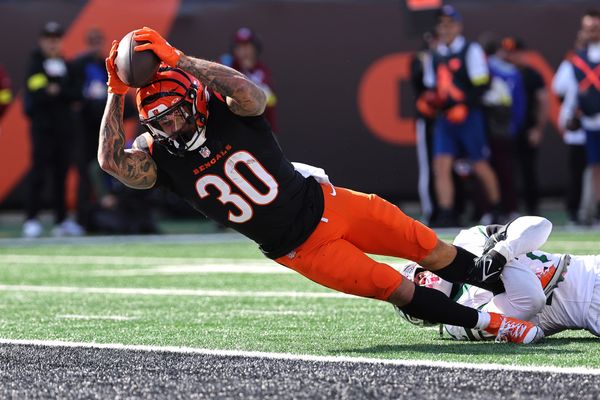 Oct 26, 2025; Cincinnati, Ohio, USA; Cincinnati Bengals running back Chase Brown (30) scores a touchdown during the second quarter against the New York Jets at Paycor Stadium. Mandatory Credit: Joseph Maiorana-Imagn Images