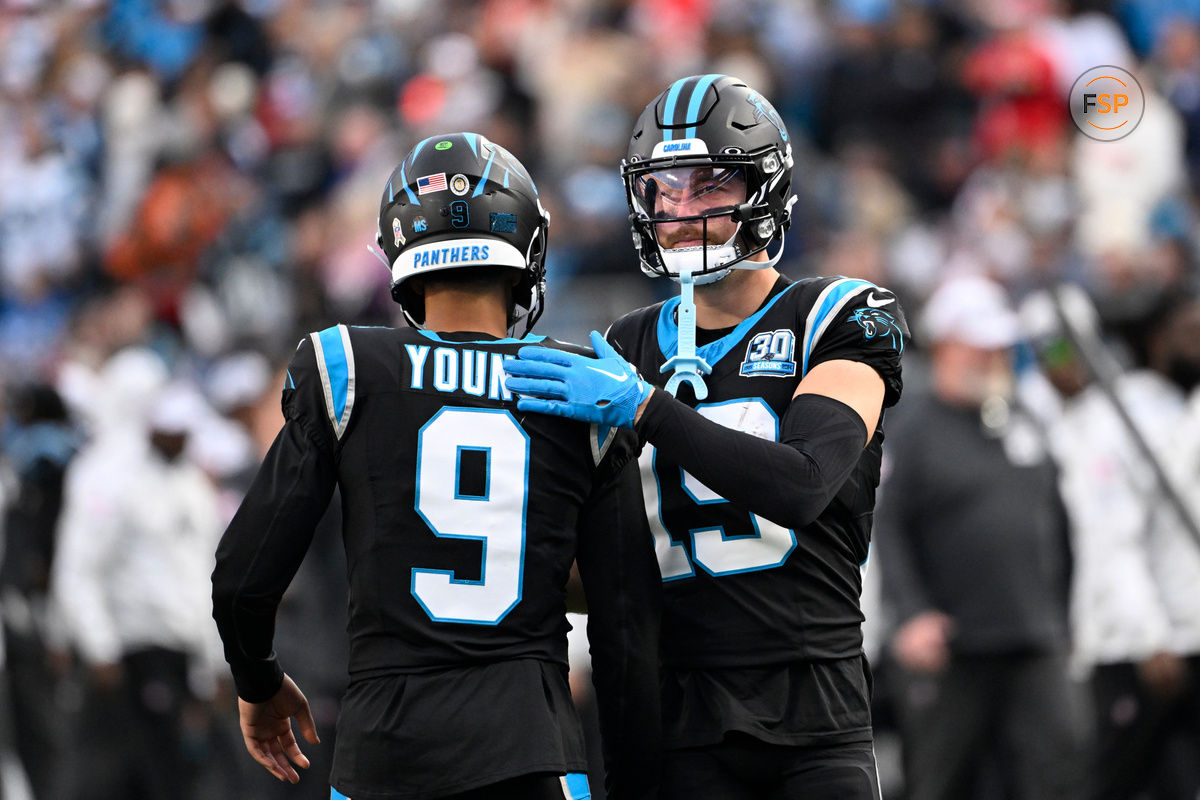 Nov 24, 2024; Charlotte, North Carolina, USA; Carolina Panthers quarterback Bryce Young (9) with wide receiver Adam Thielen (19) on the field in the fourth quarter at Bank of America Stadium. Credit: Bob Donnan-Imagn Images