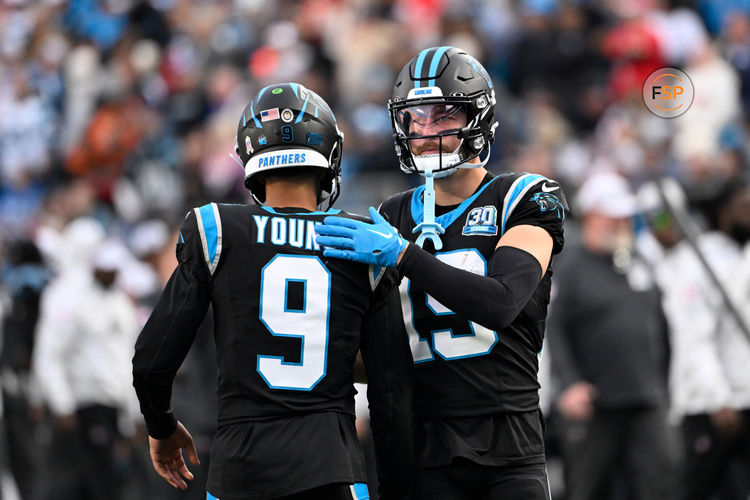 Nov 24, 2024; Charlotte, North Carolina, USA; Carolina Panthers quarterback Bryce Young (9) with wide receiver Adam Thielen (19) on the field in the fourth quarter at Bank of America Stadium. Credit: Bob Donnan-Imagn Images