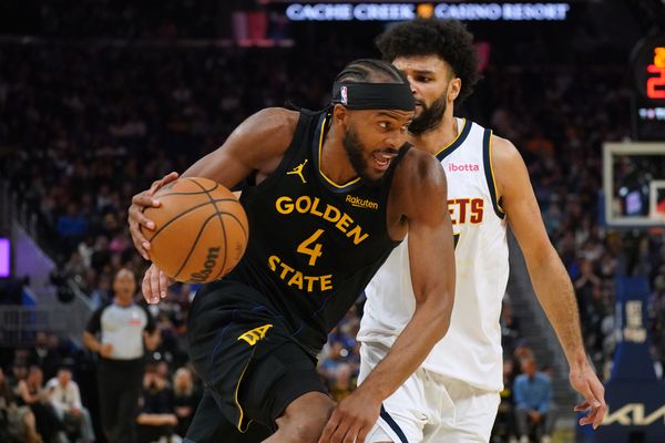 Feb 22, 2026; San Francisco, California, USA;  Golden State Warriors guard Moses Moody (4) dribbles by Denver Nuggets guard Jamal Murray (27) in the second quarter at Chase Center. Mandatory Credit: David Gonzales-Imagn Images