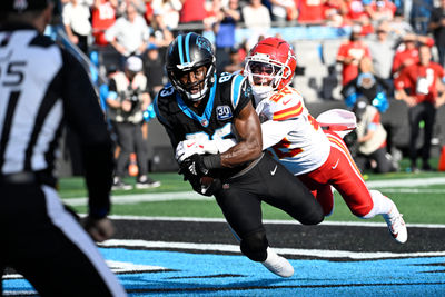 Nov 24, 2024; Charlotte, North Carolina, USA;  Carolina Panthers wide receiver David Moore (83) catches a touchdown as Kansas City Chiefs cornerback Trent McDuffie (22) defends in the third quarter at Bank of America Stadium. Mandatory Credit: Bob Donnan-Imagn Images