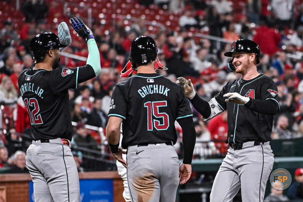 ST. LOUIS, MO - APRIL 23: Arizona Diamondbacks designated hitter Pavin Smith (26) gets congratulated on his grand slam by Arizona Diamondbacks left fielder Lourdes Gurriel Jr. (12) and Arizona Diamondbacks right fielder Randal Grichuk (15) during a game between the Arizona Diamondbacks and the St. Louis Cardinals on Tuesday April 23, 2024, at Busch Stadium in St. Louis MO (Photo by Rick Ulreich/Icon Sportswire)