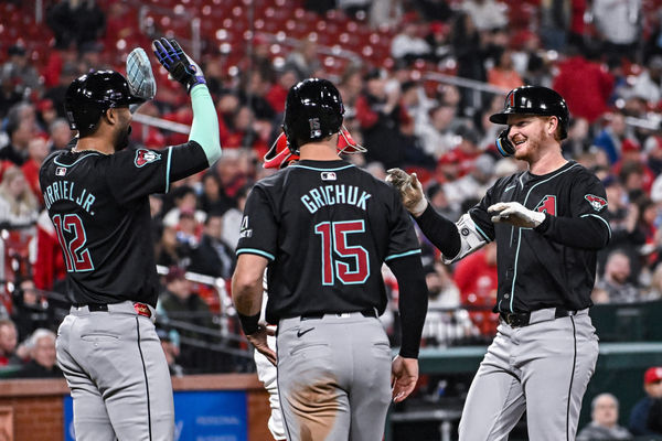 ST. LOUIS, MO - APRIL 23: Arizona Diamondbacks designated hitter Pavin Smith (26) gets congratulated on his grand slam by Arizona Diamondbacks left fielder Lourdes Gurriel Jr. (12) and Arizona Diamondbacks right fielder Randal Grichuk (15) during a game between the Arizona Diamondbacks and the St. Louis Cardinals on Tuesday April 23, 2024, at Busch Stadium in St. Louis MO (Photo by Rick Ulreich/Icon Sportswire)