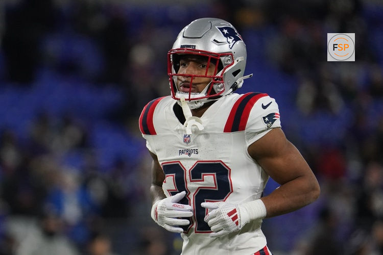Dec 21, 2025; Baltimore, Maryland, USA;  New England Patriots running back Treveyon Henderson (32) warms up prior to the game against the Baltimore Ravens at M&T Bank Stadium. Credit: James Lang-Imagn Images
