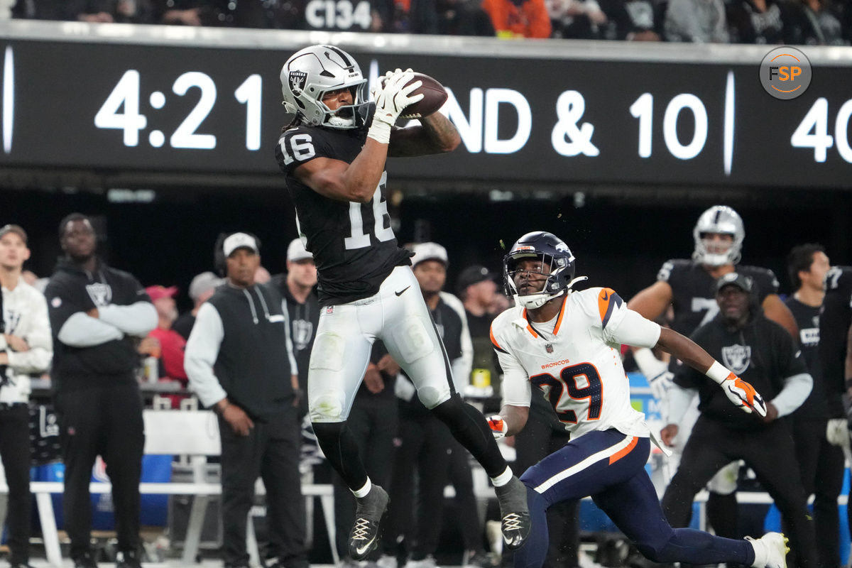 Nov 24, 2024; Paradise, Nevada, USA; Las Vegas Raiders wide receiver Jakobi Meyers (16) catches the ball against Denver Broncos cornerback Ja'Quan McMillian (29) in the fourth quarter at Allegiant Stadium. Credit: Kirby Lee-Imagn Images