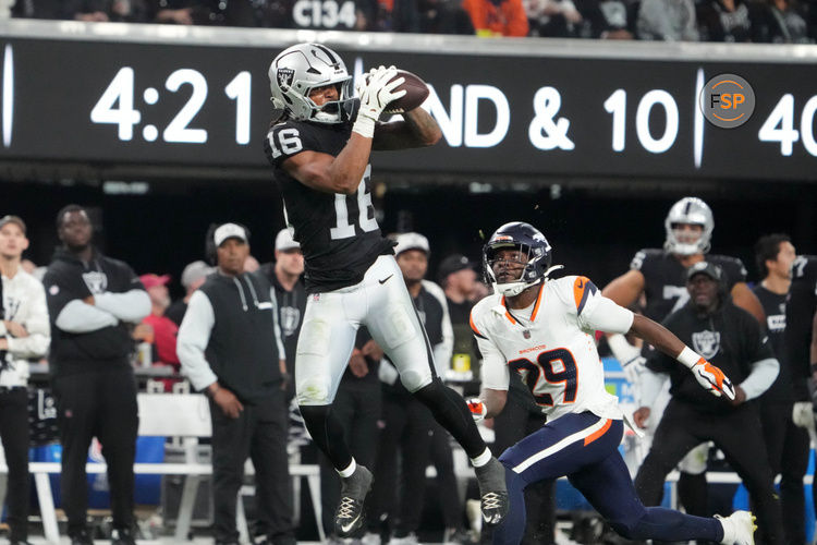 Nov 24, 2024; Paradise, Nevada, USA; Las Vegas Raiders wide receiver Jakobi Meyers (16) catches the ball against Denver Broncos cornerback Ja'Quan McMillian (29) in the fourth quarter at Allegiant Stadium. Credit: Kirby Lee-Imagn Images