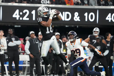 Nov 24, 2024; Paradise, Nevada, USA; Las Vegas Raiders wide receiver Jakobi Meyers (16) catches the ball against Denver Broncos cornerback Ja'Quan McMillian (29) in the fourth quarter at Allegiant Stadium. Mandatory Credit: Kirby Lee-Imagn Images