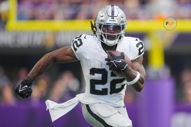 Aug 10, 2024; Minneapolis, Minnesota, USA; Las Vegas Raiders running back Alexander Mattison (22) runs with the ball against the Minnesota Vikings in the second quarter at U.S. Bank Stadium. Credit: Brad Rempel-USA TODAY Sports