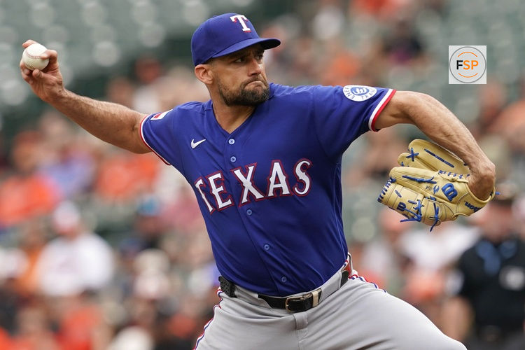 Apr 1, 2026; Baltimore, Maryland, USA; Texas Rangers pitcher Nathan Eovaldi (left) delivers during the first inning against the Baltimore Orioles at Oriole Park at Camden Yards. Credit: Mitch Stringer-Imagn Images