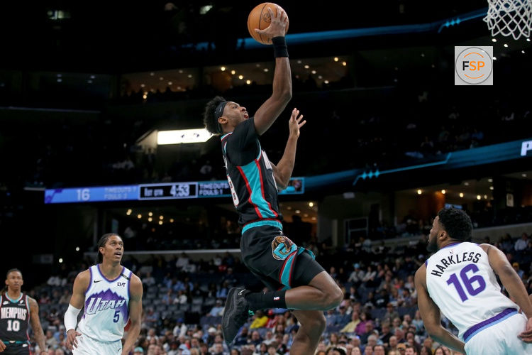 Feb 20, 2026; Memphis, Tennessee, USA; Memphis Grizzlies forward Olivier-Maxence Prosper (18) drives during the first quarter against the Utah Jazz at FedExForum. Credit: Petre Thomas-Imagn Images