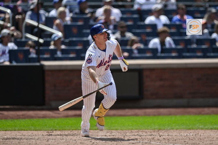 Jul 23, 2025; New York City, New York, USA; New York Mets first baseman Pete Alonso (20) hits a single against the Los Angeles Angels during the seventh inning at Citi Field. Credit: John Jones-Imagn Images