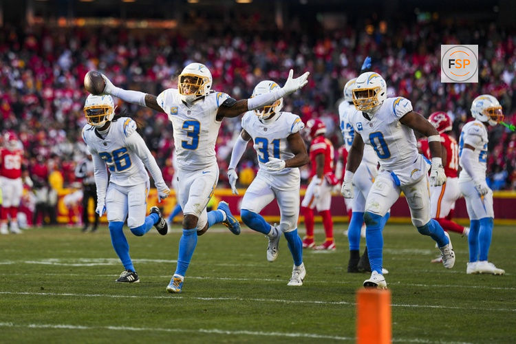 Dec 14, 2025; Kansas City, Missouri, USA; Los Angeles Chargers safety Derwin James Jr. (3) celebrates with cornerback Donte Jackson (26) and linebacker Daiyan Henley (0) following an interception against the Kansas City Chiefs during the fourth quarter at GEHA Field at Arrowhead Stadium. Credit: Jay Biggerstaff-Imagn Images