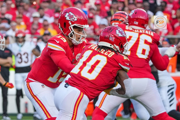 Sep 15, 2024; Kansas City, Missouri, USA; Kansas City Chiefs quarterback Patrick Mahomes (15) hands off to running back Isiah Pacheco (10) against the Cincinnati Bengals during the game at GEHA Field at Arrowhead Stadium. Credit: Denny Medley-Imagn Images