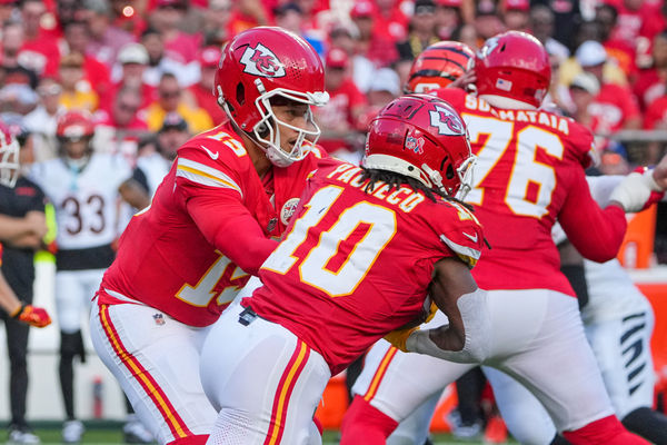 Sep 15, 2024; Kansas City, Missouri, USA; Kansas City Chiefs quarterback Patrick Mahomes (15) hands off to running back Isiah Pacheco (10) against the Cincinnati Bengals during the game at GEHA Field at Arrowhead Stadium. Mandatory Credit: Denny Medley-Imagn Images