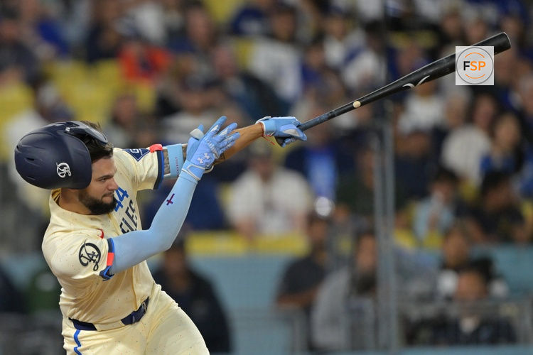 Apr 11, 2026; Los Angeles, California, USA; Los Angeles Dodgers center fielder Andy Pages (44) hits a RBI double in the eighth inning against the Texas Rangers at Dodger Stadium. Credit: Jayne Kamin-Oncea-Imagn Images