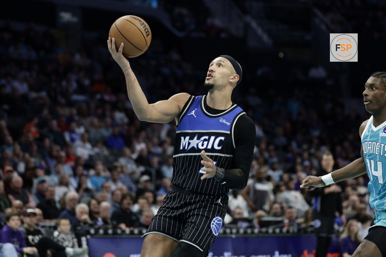 Mar 19, 2026; Charlotte, North Carolina, USA; Orlando Magic guard Jalen Suggs (4) drives to the basket during the third quarter against the Charlotte Hornets at Spectrum Center. Credit: Brian Westerholt-Imagn Images